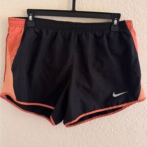 Nike Black and Orange Athletic Shorts with Curved Hem